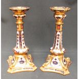 A pair of Royal Crown Derby Japan pattern candlesticks, numbered 1128. Seconds. 27 cm high.