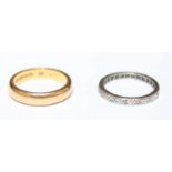 A 22ct gold wedding band, approx. 6.3 grams, together with an 18ct gold and diamond eternity ring,