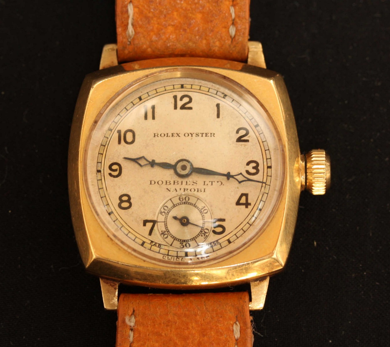 A 1928 Rolex Oyster 18ct gold angular cushion cased wrist watch with silvered dial and Arabic