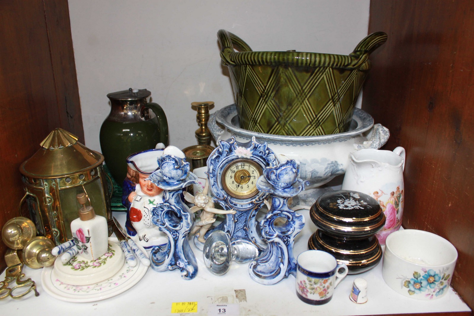 SECTION 13. A collection of assorted ceramics including a Toby jug, punch bowl, clock garniture,