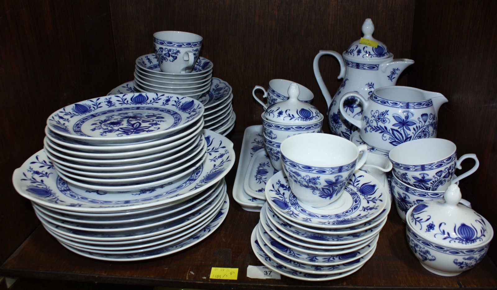 SECTION 37. A German Winterling porcelain onion pattern dinner service, comprising dinner plates,