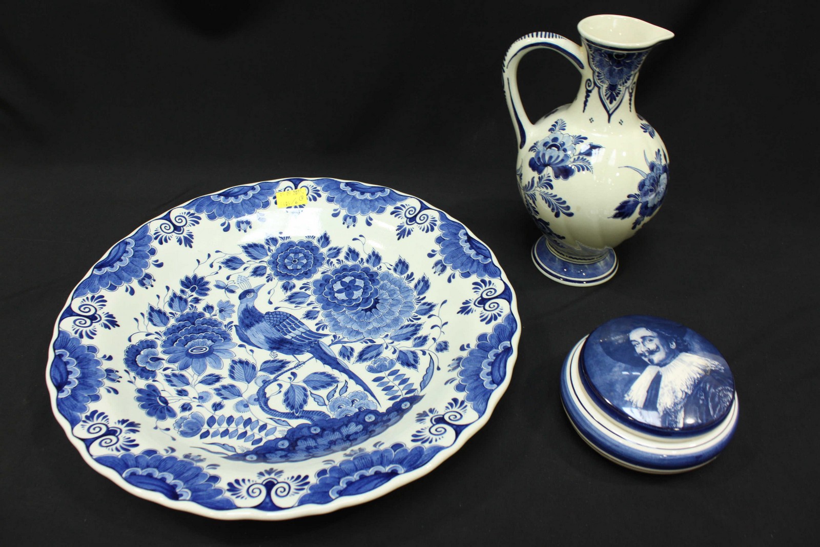 SECTION 48.  A large 20th century Delft blue and white charger decorated with a bird of paradise