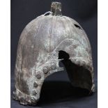 An antique Western Zhou Dynasty (1050 -771 BC), cast bronze helmet, with D - shaped openings to