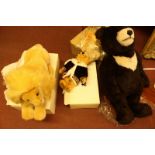 Four modern Steiff toys including a large brown bear, two small bears and a lion, all boxed