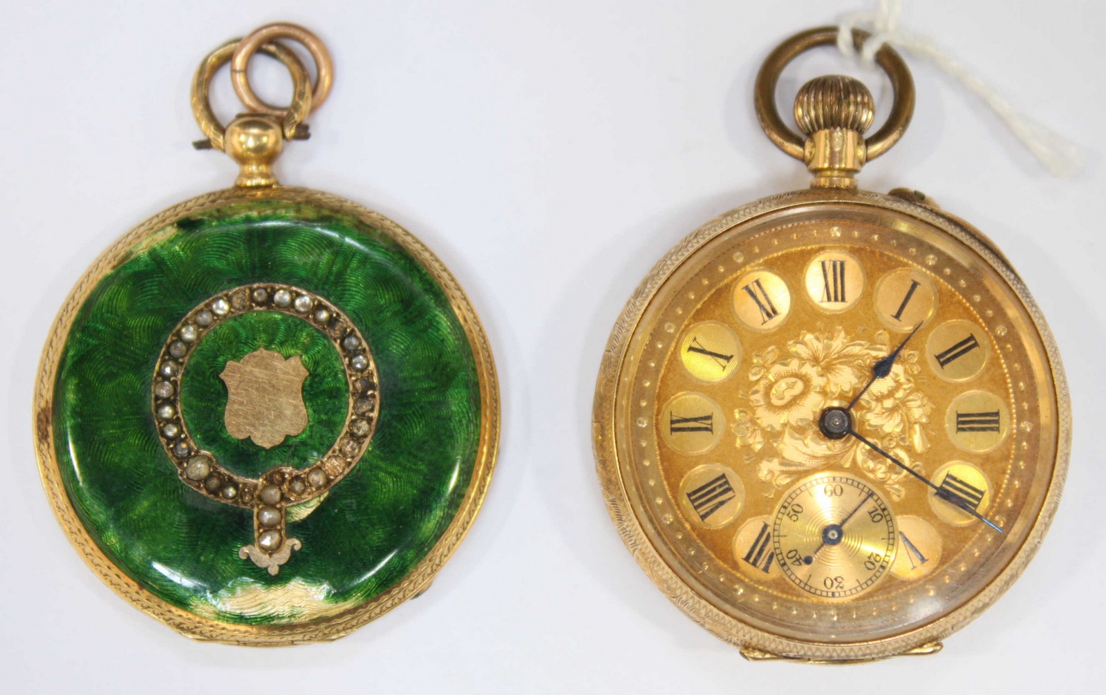 A ladies small 18K fob watch with gilt dial and black Roman numerals. Total weight: 31.2 grams.