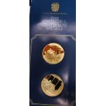 A set of 26 silver gilt Churchill proof medallions, together with albums and coin cases.