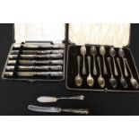 A cased set of eleven silver coffee spoons, together with a cased set of six fruit knives with