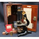 A Watson & Sons 'Service' microscope, in a fitted mahogany case with assorted lens and accessories.