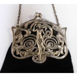 A Victorian Art Nouveau silver and velvet purse, the clasp decorated with a nude woman surrounded by