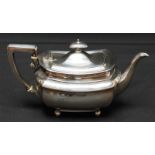 A Victorian silver teapot, hallmarked London 1901, with silver handle and ivory spacers, supported