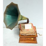 An early horn type gramophone, with large green painted horn and a quantity of 78 records.