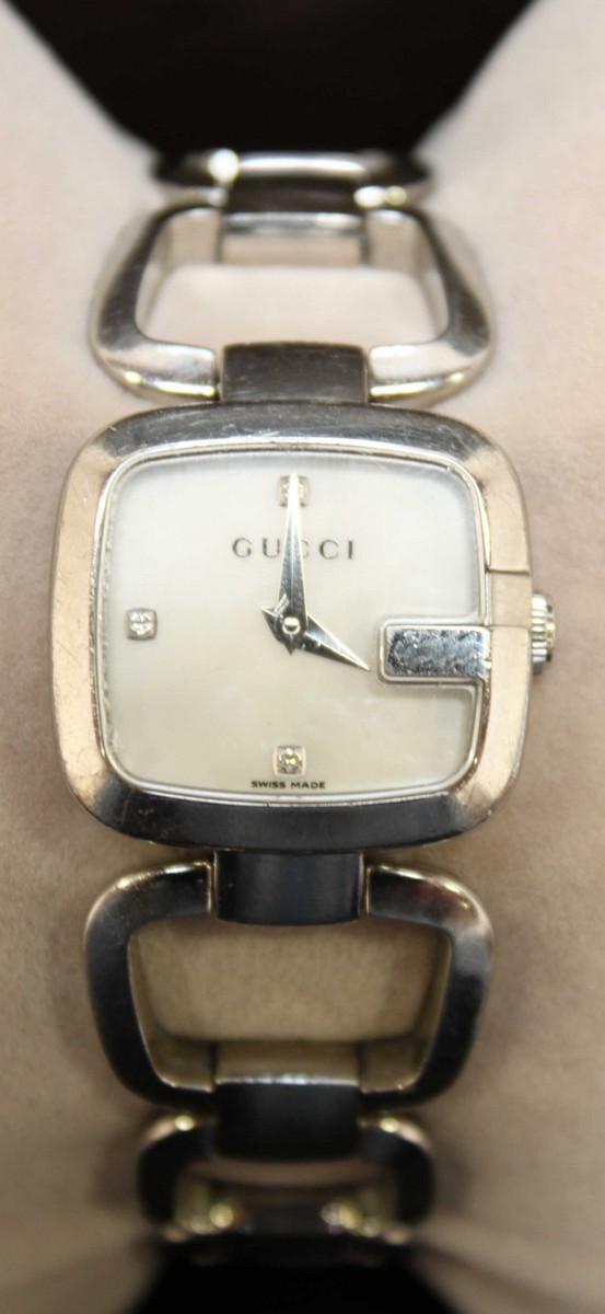 A ladies Gucci stainless steel wrist watch, with mother of pearl dial and open link bracelet, in