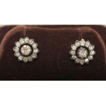 A pair of Victorian diamond earrings, each set with cushion shaped old cut diamond weighing