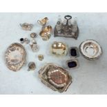 A box of assorted silver plated items.