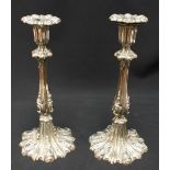 A pair of ornate silver-plated candlesticks in the rococo "style" with detachable drip-pans, 28cm