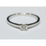 An 18ct white gold solitaire diamond ring four claw set with a round brilliant cut diamond