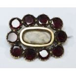 A 15ct gold Georgian mourning brooch set with flat garnets, total approx weight of brooch 4.9