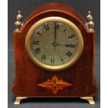 A small Edwardian mahogany mantle clock, with silvered dial and black Roman numerals, inlaid case