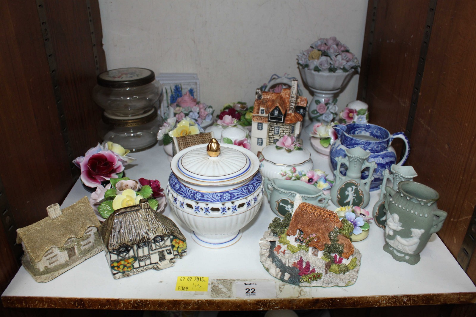 SECTION 22. A collection of ceramics including miniature cottages, posy vases, trinket boxes and