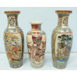 A large pair of contemporary Japanese porcelain vases, decorated with panels of geishas in