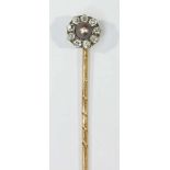 An 18ct gold pin topped with a pearl and diamond cluster, approx total weight of pin 2.0 grams.