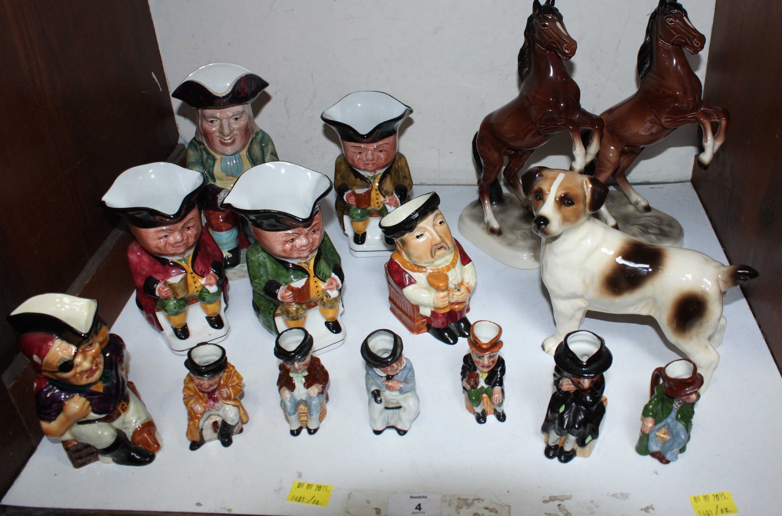 SECTION 4. A collection of Beswick and other Toby jugs, together with two rearing horses and a