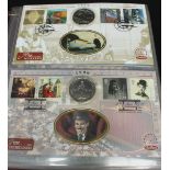 A collection of first day covers in four albums, many including coins.