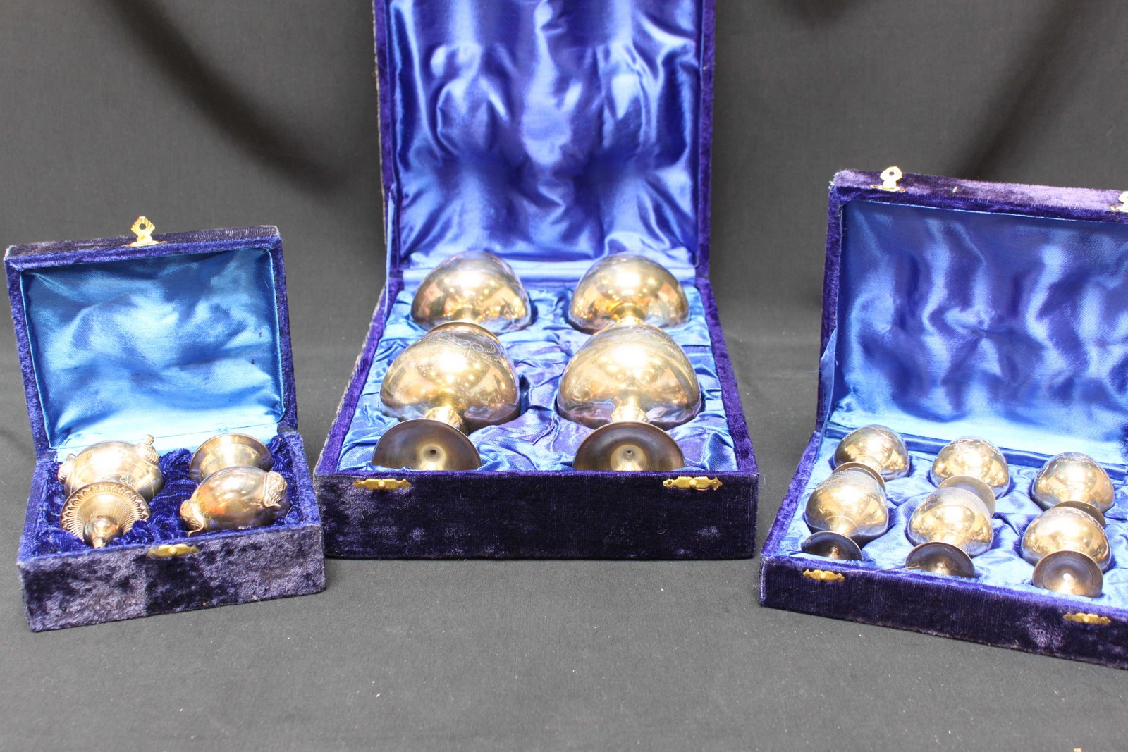 Two boxed sets of Eastern silver plated boxed goblets and a pair of salts, together with a