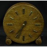 A handmade electric oak mantel clock, the circular dial with batons denoting hours. Dial measures,