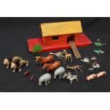 A painted wooden Noah's Ark with various painted lead animals.