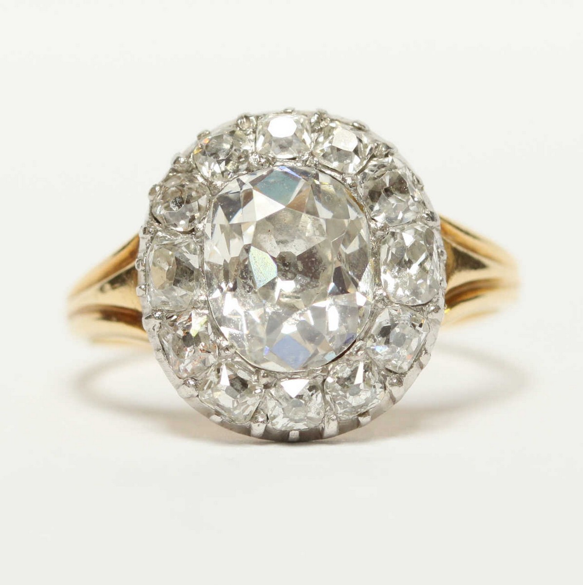 A Victorian oval diamond cluster ring, central oval mixed cut diamond, estimated around 1.5