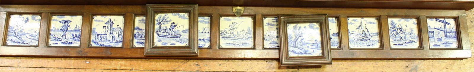 Eleven various blue & white printed Dutch delft tiles, decorated with figures, boats and churches,