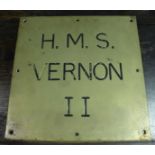 An HMS Vernon II ships brass name plate, engraved with blacked letters, and on the reverse '