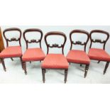 A set of five Victorian mahogany balloon back chairs, with rose upholstered seats and raised on