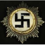 A WWII German Third Reich Deutsches Kreuz (German Cross) Gold order, with black enamel swastika on a