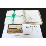 Two 9ct gold bar brooches, a collection of six gilt metal tie pins, a set of cased ceramic dress