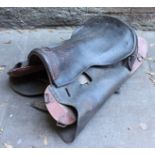 A WWI French leather and wooden saddle.
