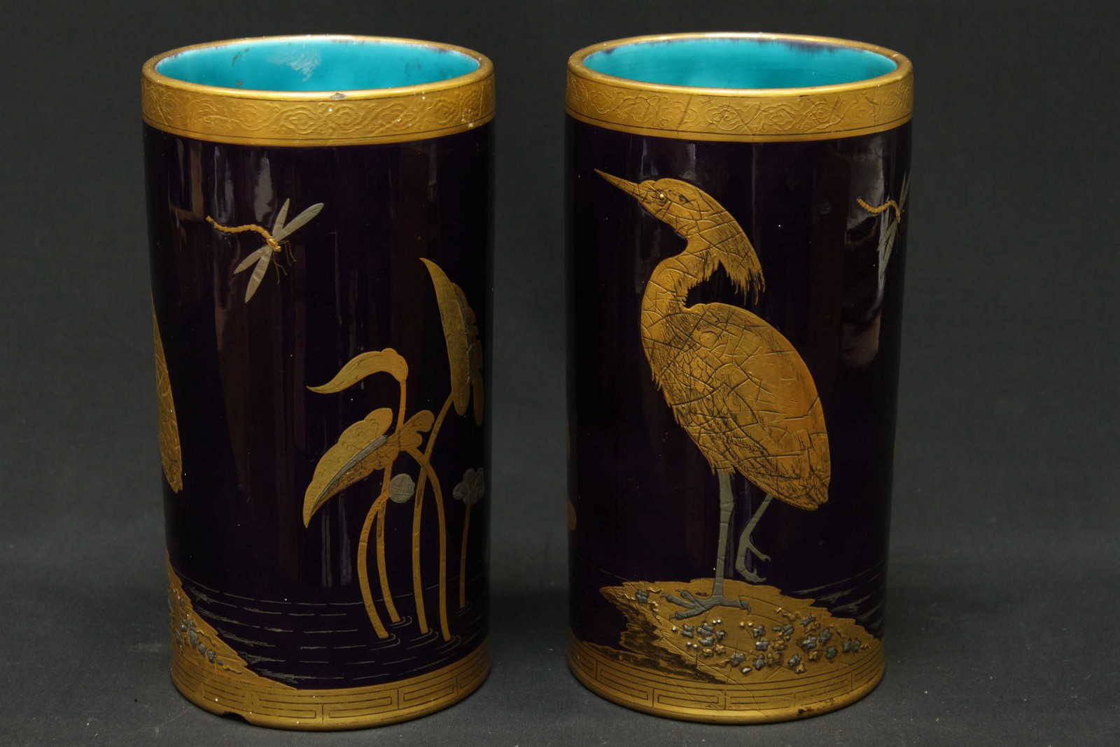 A pair of Minton vases of cylindrical form, decorated with birds and dragonflies on lily pads and