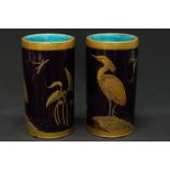 A pair of Minton vases of cylindrical form, decorated with birds and dragonflies on lily pads and