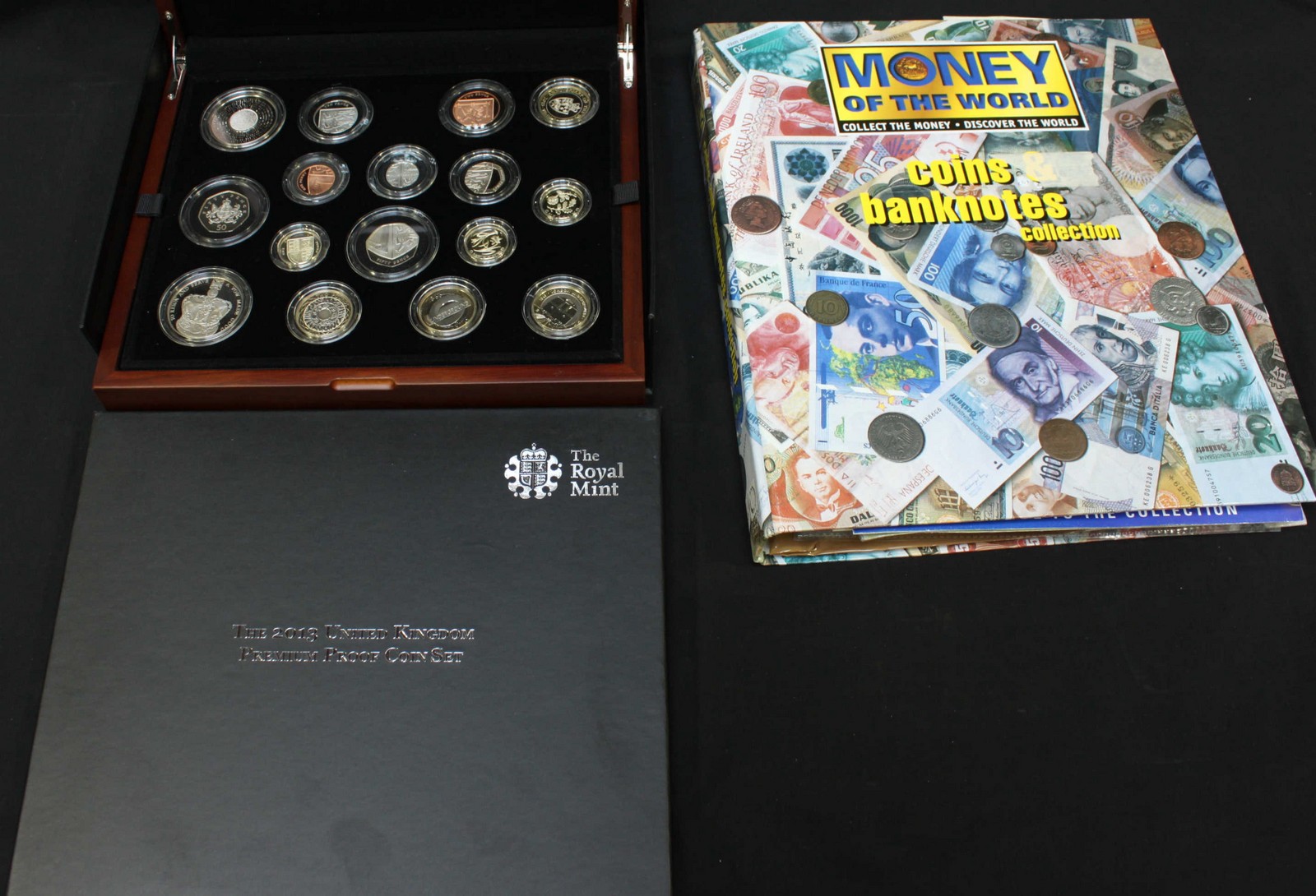 A collection of first day covers in albums, many including coins, together with a stamp album, a