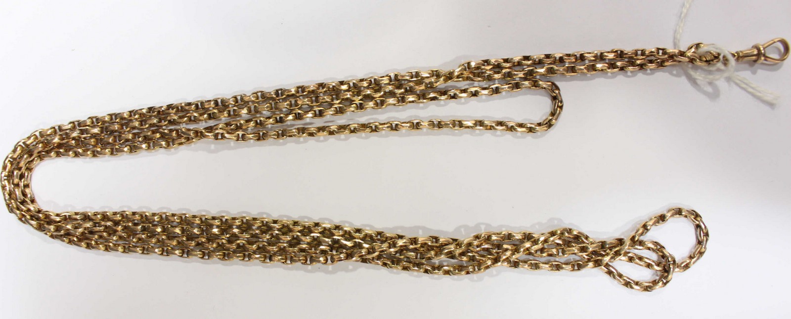 WITHDRAWN: A long 9ct gold guard or muff chain. 29.4 grams.
