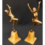 A pair of Art Deco spelter figure of dancing girls, supported on onyx bases. AF.