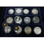 A collection of assorted Canadian and other silver and nickel proof coins in a coin case, together