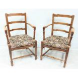 A pair of early 20th century stained walnut carver chairs, horizontal zig-zag back rails and