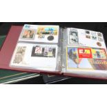 A collection of first day covers in albums, many including coins, together with a quantity of