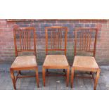 A set of five Edwardian, inlaid mahogany 'Shoolbred and co.' standard chairs with shaped stiles