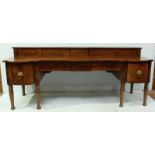 A large Regency mahogany sideboard/serving table, the flame-veneered mahogany top with long