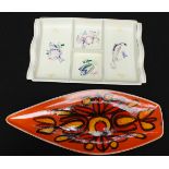 A Poole pottery shaped dish decorated in bright colours, together with another Poole hors d'