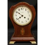 An Edwardian mahogany mantel clock of balloon form, retailed by Mappin & Webb, with eight-day Japy