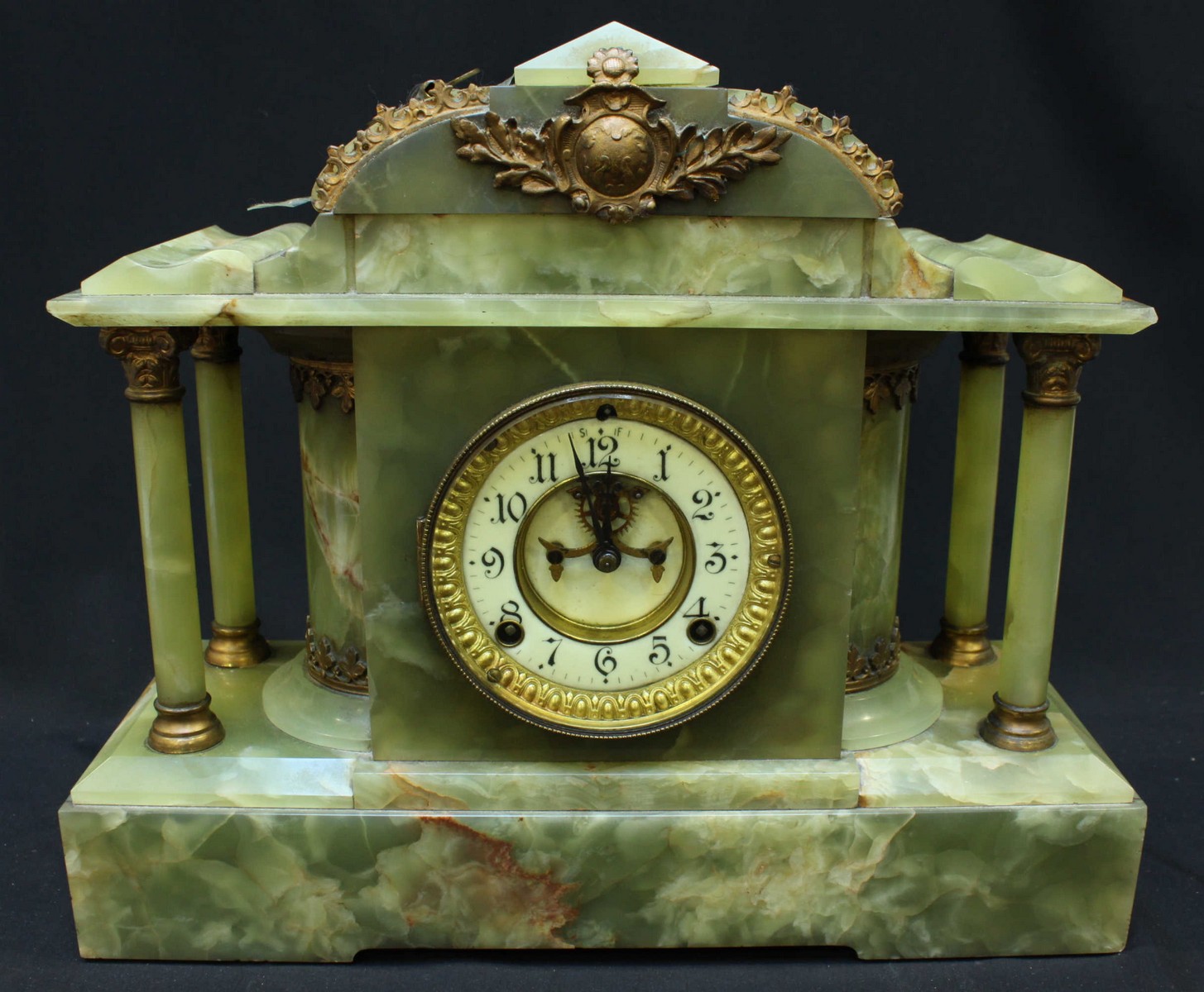 A large Victorian onyx mantle clock, with American Ansonia movement, white enamel dial and column